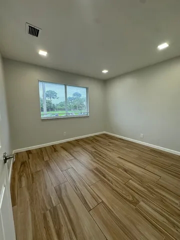 a view of room and wooden floor