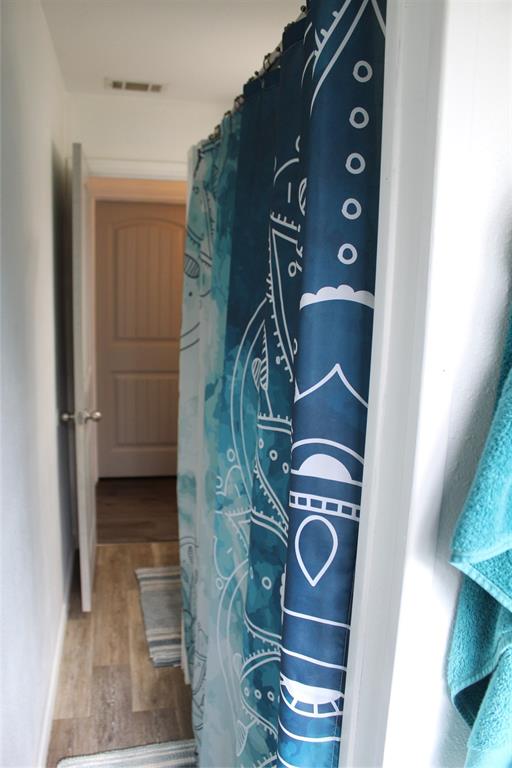 402 Cleveland Street Bailey, TX 75452 - Photo 12 of 17 Detailed view of wood finished floors and baseboards