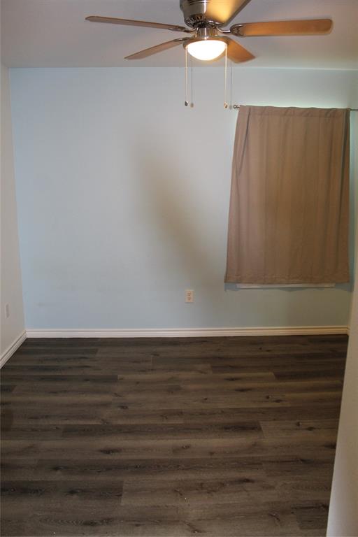 402 Cleveland Street Bailey, TX 75452 - Photo 13 of 17 Empty room featuring dark wood finished floors and ceiling fan