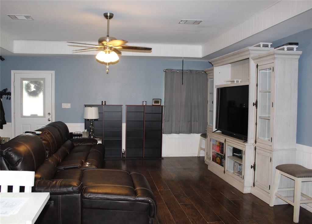402 Cleveland Street Bailey, TX 75452 - Photo 4 of 17 Living area with a ceiling fan and wood finished floors