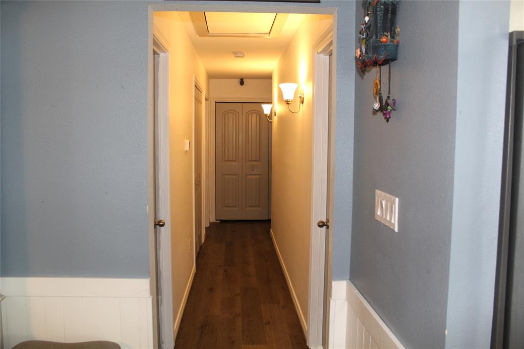 402 Cleveland Street Bailey, TX 75452 - Photo 6 of 17 Corridor featuring dark wood-type flooring