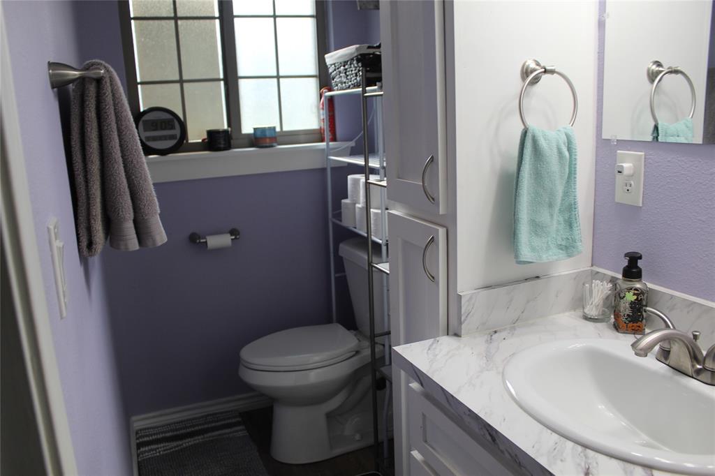 402 Cleveland Street Bailey, TX 75452 - Photo 9 of 17 Primary bathroom with vanity and toilet