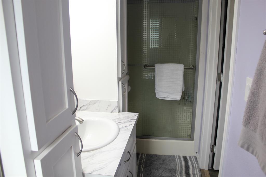 402 Cleveland Street Bailey, TX 75452 - Photo 10 of 17 Primary bathroom with vanity and a stall shower