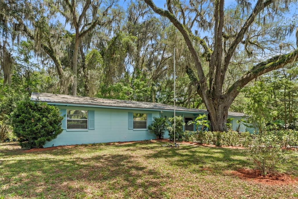 4825 Southwest 19th Street Gainesville, FL 32608 - Photo 31 of 40 a view of a house with a yard