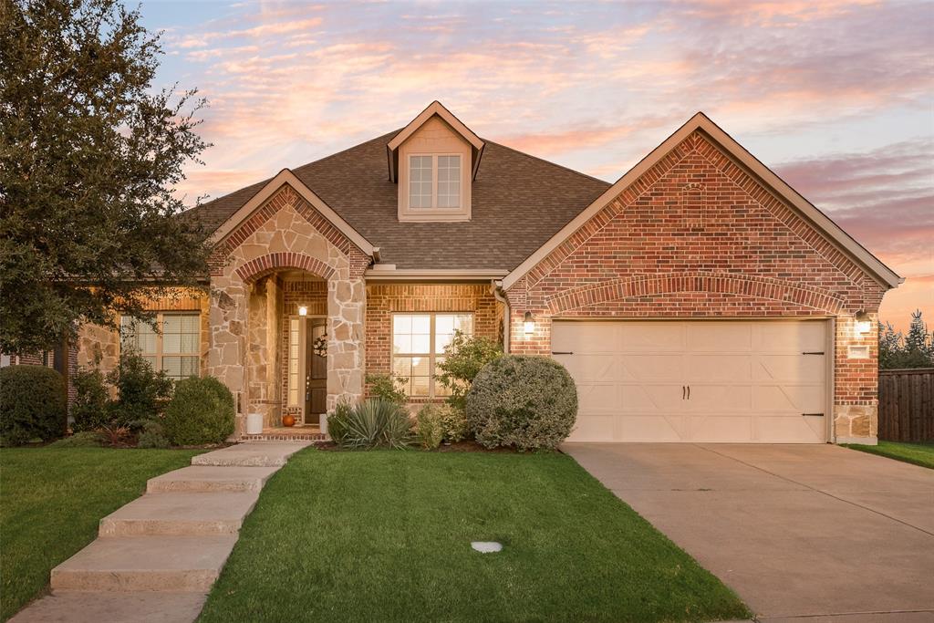 14026 Gutierrez Road Frisco, TX 75035 - Photo 1 of 36 a front view of house with a garden
