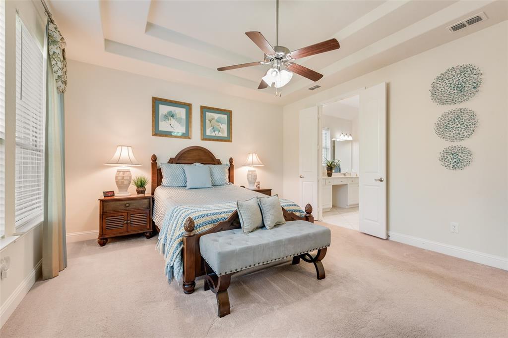 14026 Gutierrez Road Frisco, TX 75035 - Photo 14 of 36 a bedroom with a bed and a chandelier