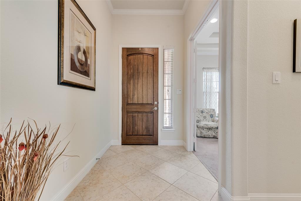 14026 Gutierrez Road Frisco, TX 75035 - Photo 18 of 36 a view of a livingroom with wooden floor and a bedroom