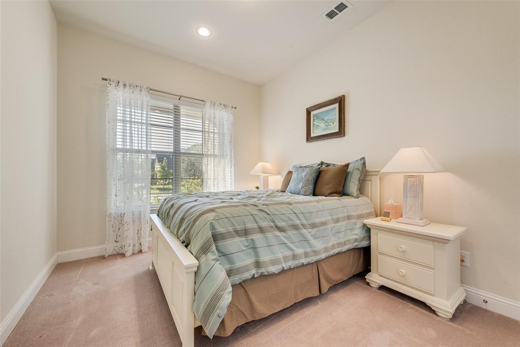 14026 Gutierrez Road Frisco, TX 75035 - Photo 21 of 36 a bedroom with a bed and a night stand