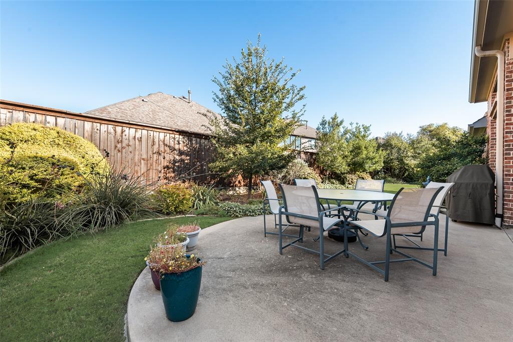 14026 Gutierrez Road Frisco, TX 75035 - Photo 28 of 36 a view of a tables and chairs in the patio