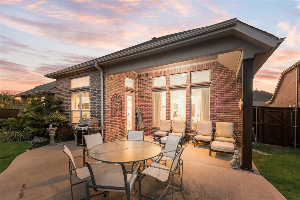 14026 Gutierrez Road Frisco, TX 75035 - Photo 29 of 36 a patio with yard glass top table and chairs