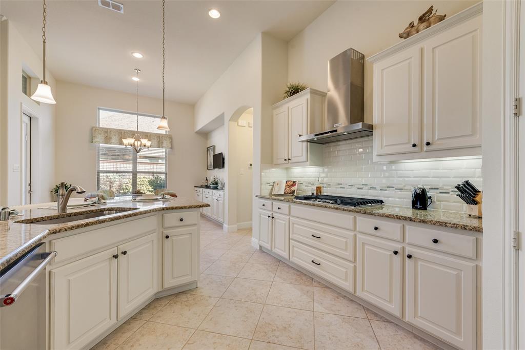 14026 Gutierrez Road Frisco, TX 75035 - Photo 3 of 36 a kitchen with sink cabinets and window