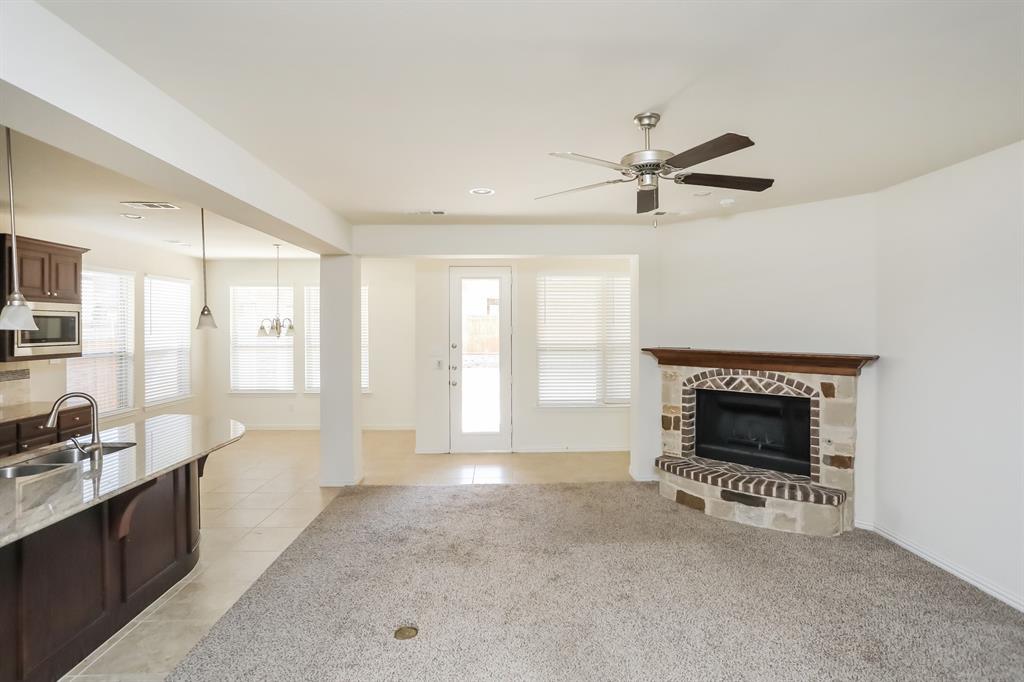 1014 Longhill Way Forney, TX 75126 - Photo 2 of 15 a living room with furniture and a fireplace