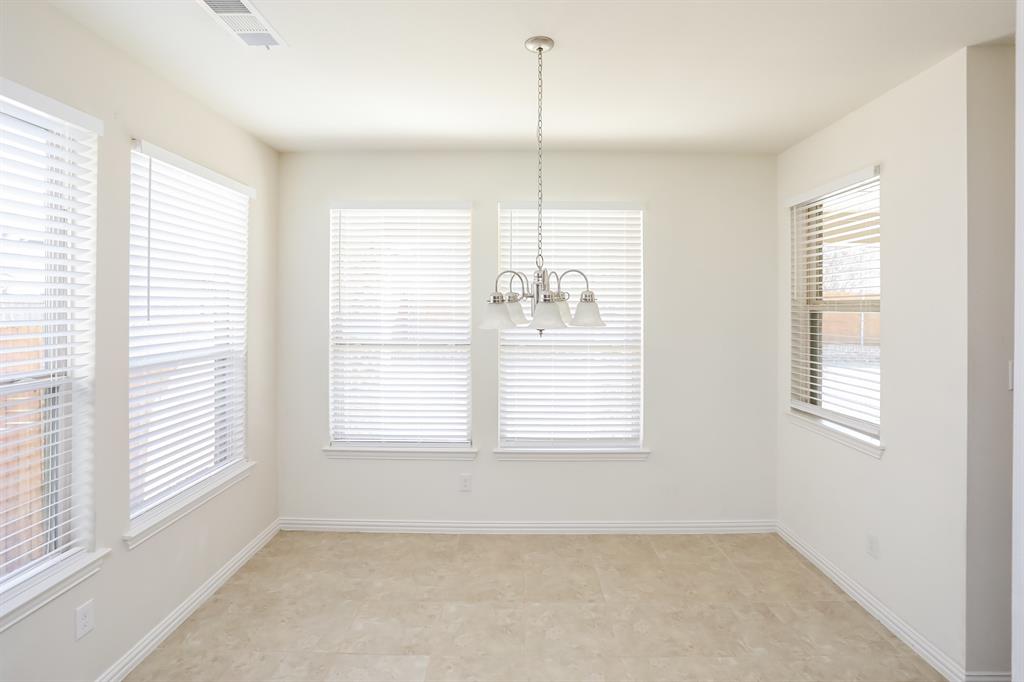 1014 Longhill Way Forney, TX 75126 - Photo 5 of 15 a view of an empty room with a window