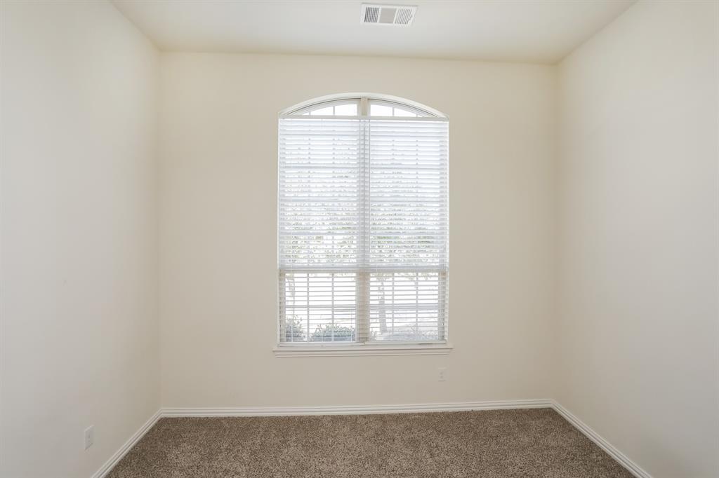 1014 Longhill Way Forney, TX 75126 - Photo 10 of 15 an empty room with a window