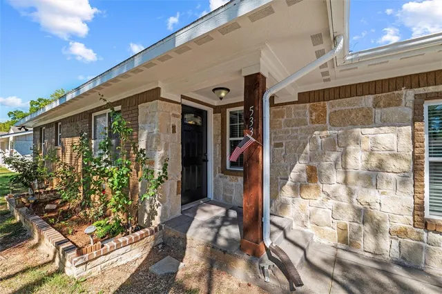 a front view of a house with a glass door