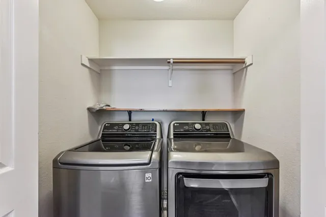 a view of a hallway with kitchen view