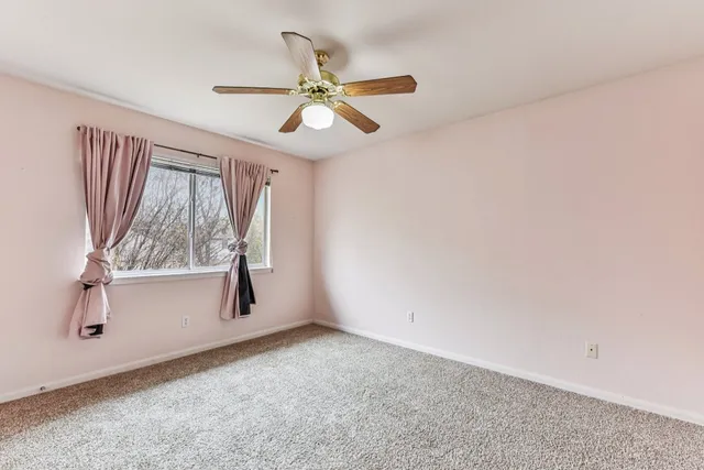 a bathroom with a toilet and a bathtub