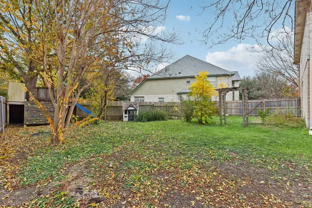 an aerial view of multiple house with yard