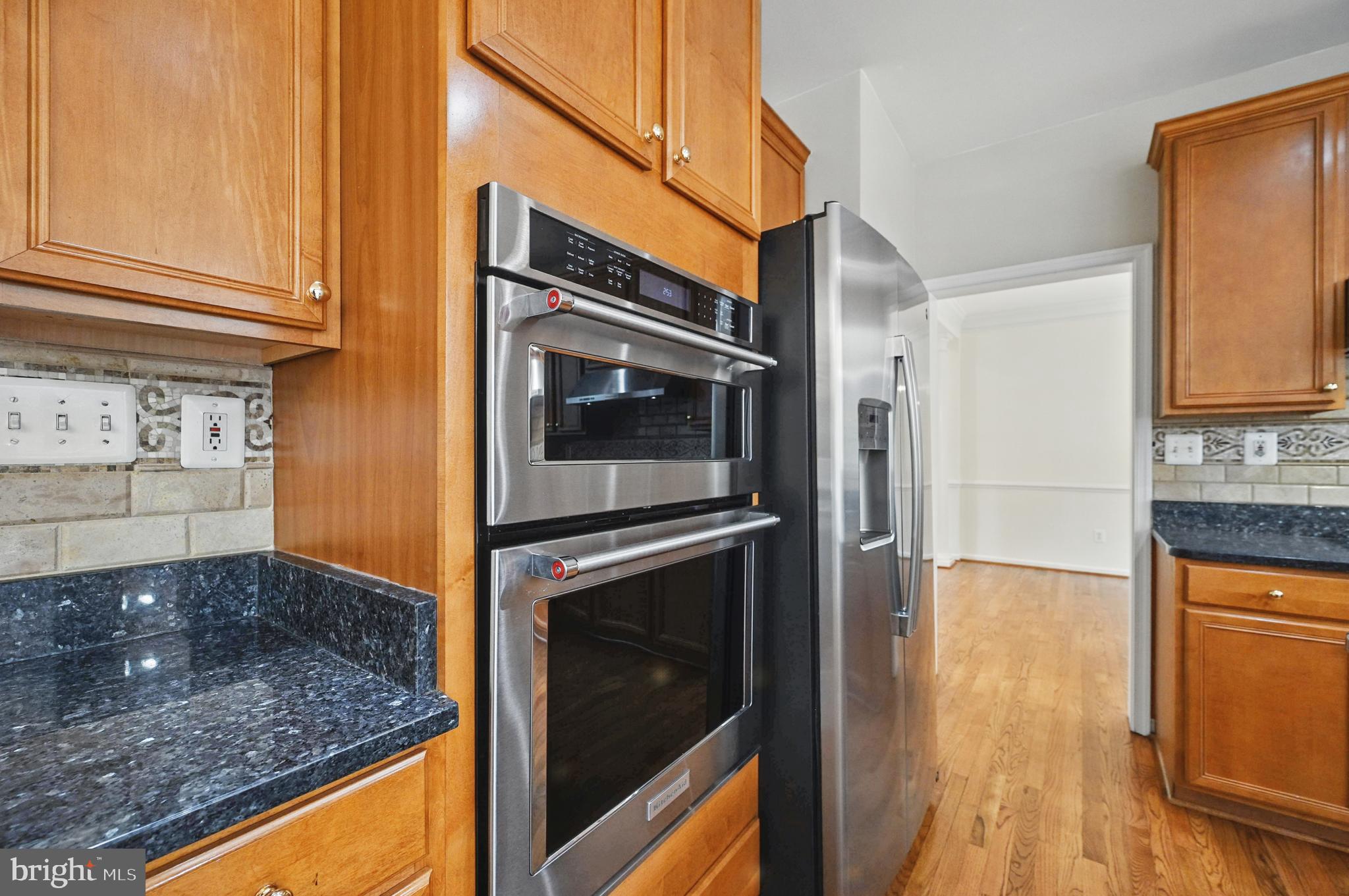 10861 Hunter Gate Way Reston, VA 20194 - Photo 11 of 79 a kitchen with stainless steel appliances granite countertop a refrigerator and a stove top oven