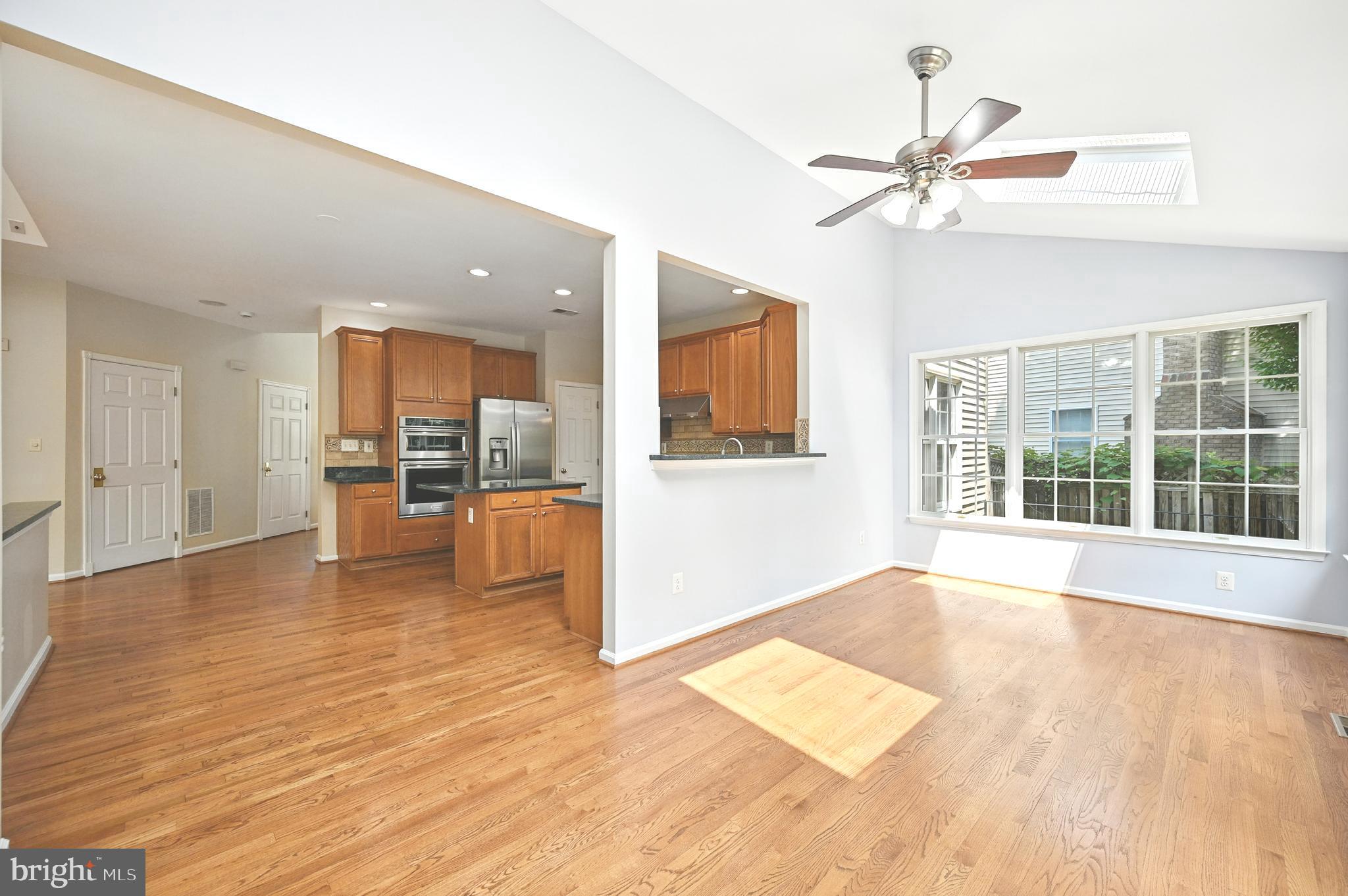 10861 Hunter Gate Way Reston, VA 20194 - Photo 16 of 79 a view of an empty room with a window and wooden floor