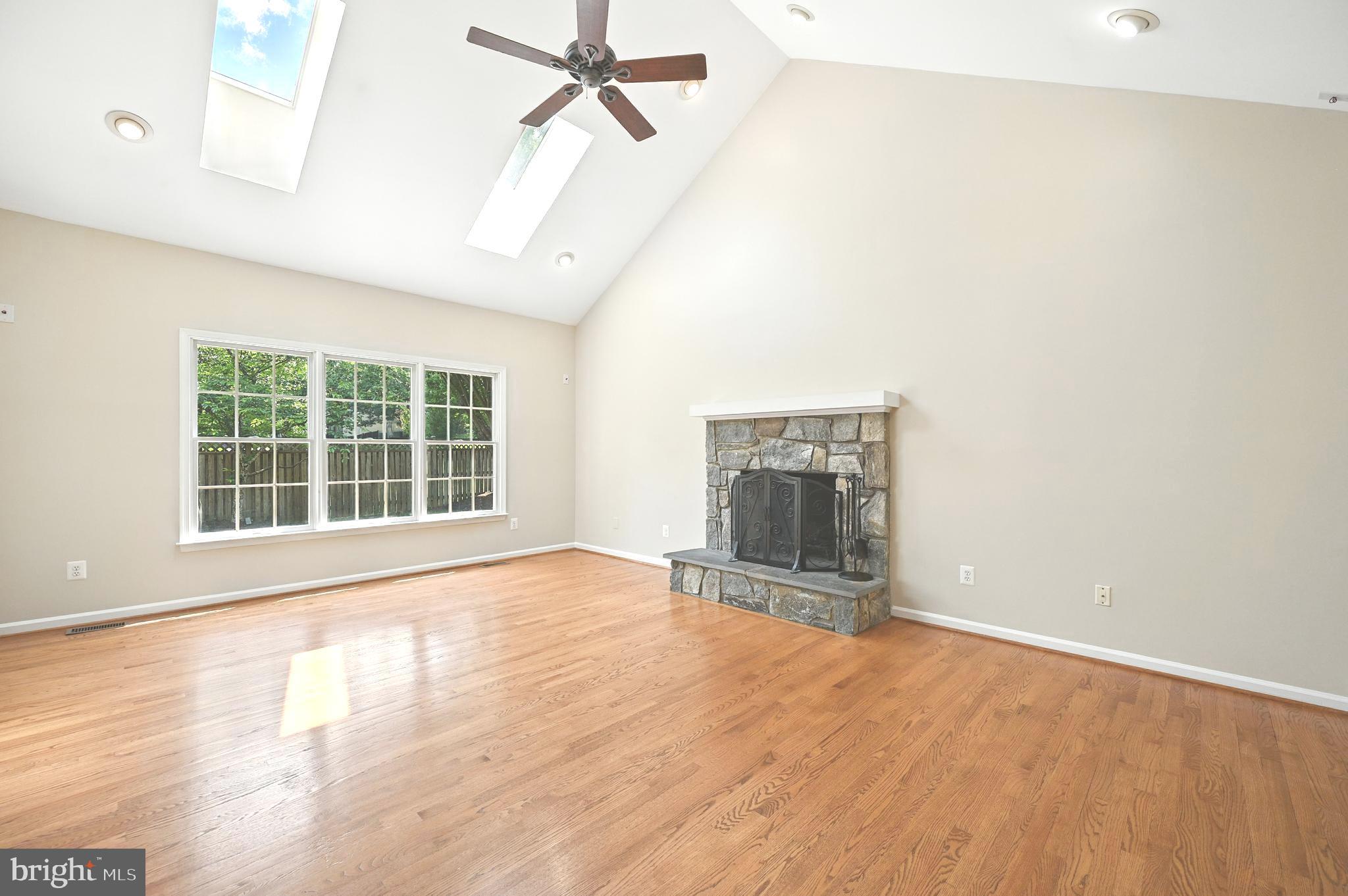 10861 Hunter Gate Way Reston, VA 20194 - Photo 19 of 79 an empty room with windows and fireplace