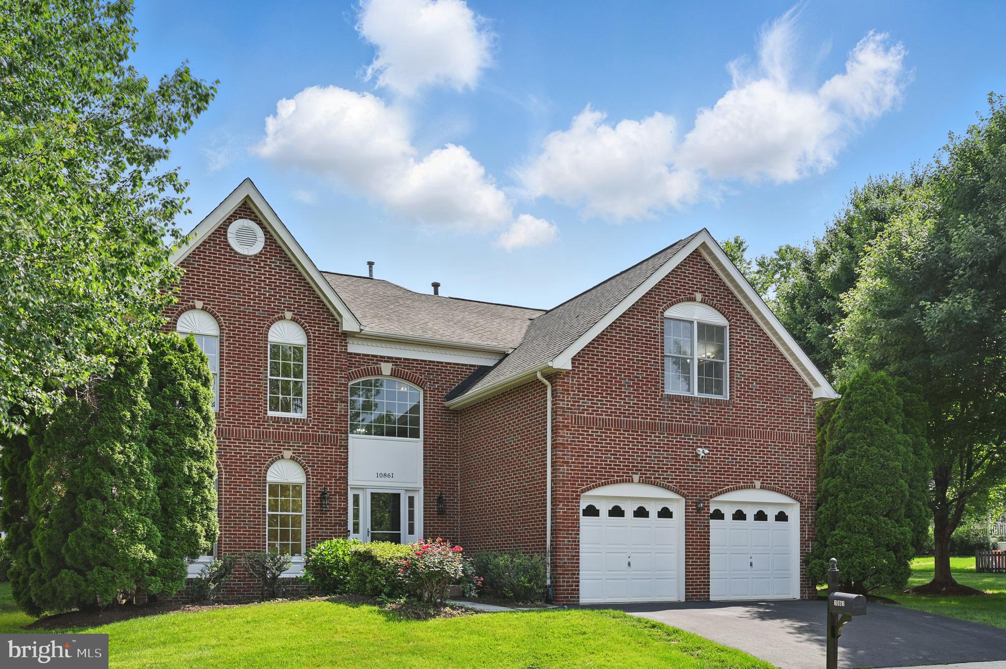 10861 Hunter Gate Way Reston, VA 20194 - Photo 2 of 79 a front view of a house with garden