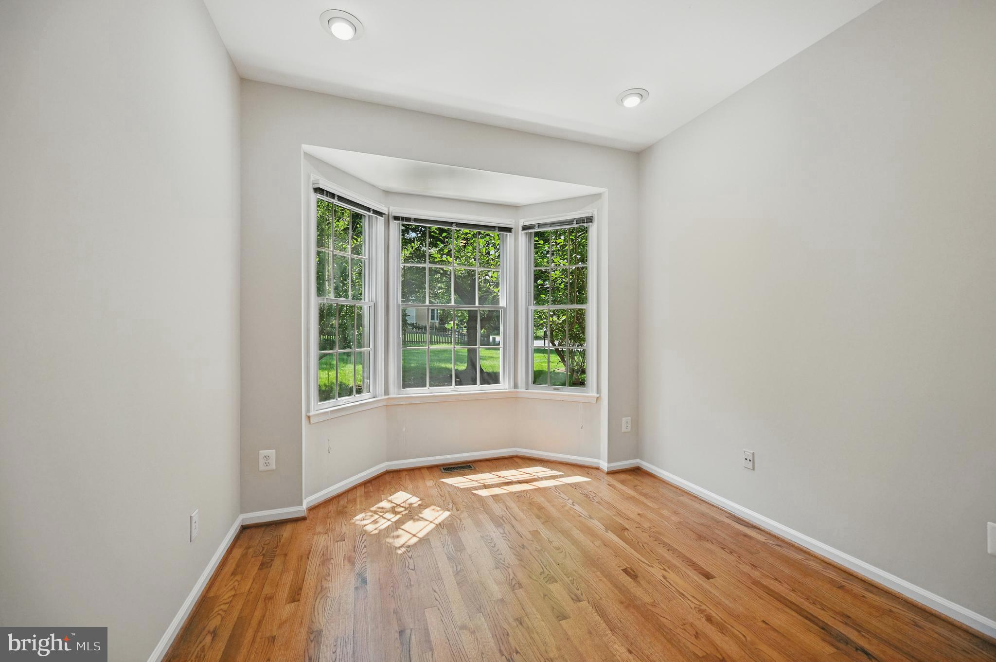 10861 Hunter Gate Way Reston, VA 20194 - Photo 22 of 79 a view of empty room with wooden floor and fan
