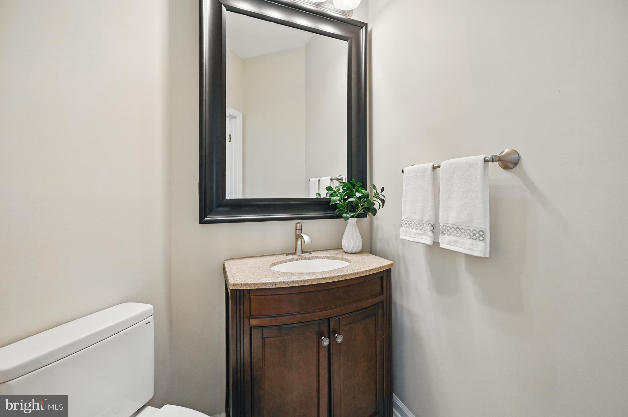 10861 Hunter Gate Way Reston, VA 20194 - Photo 24 of 79 a bathroom with a sink and a mirror