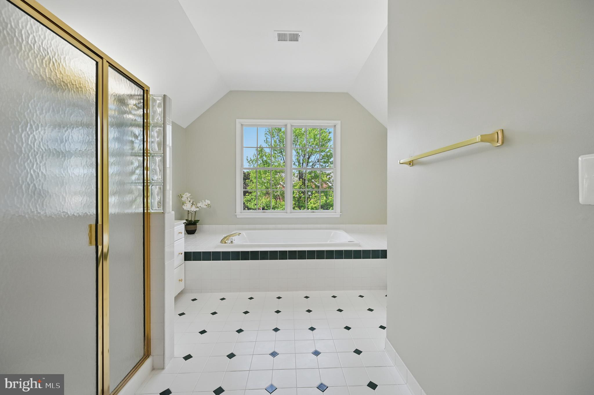 10861 Hunter Gate Way Reston, VA 20194 - Photo 36 of 79 a bathroom with a bathtub and a shower