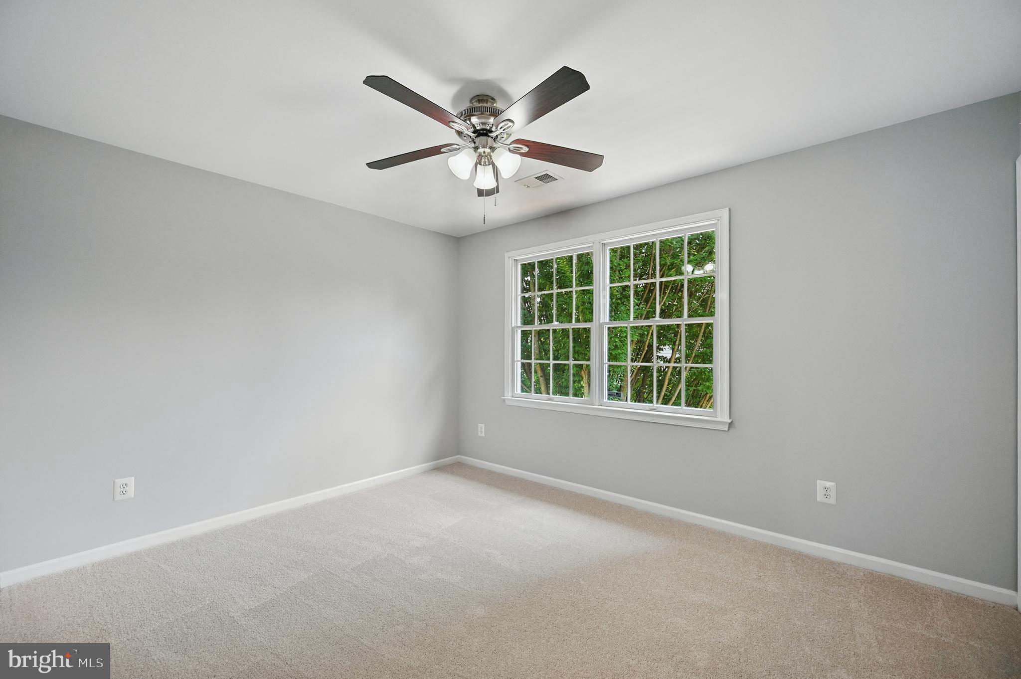 10861 Hunter Gate Way Reston, VA 20194 - Photo 42 of 79 an empty room with window and ceiling fan