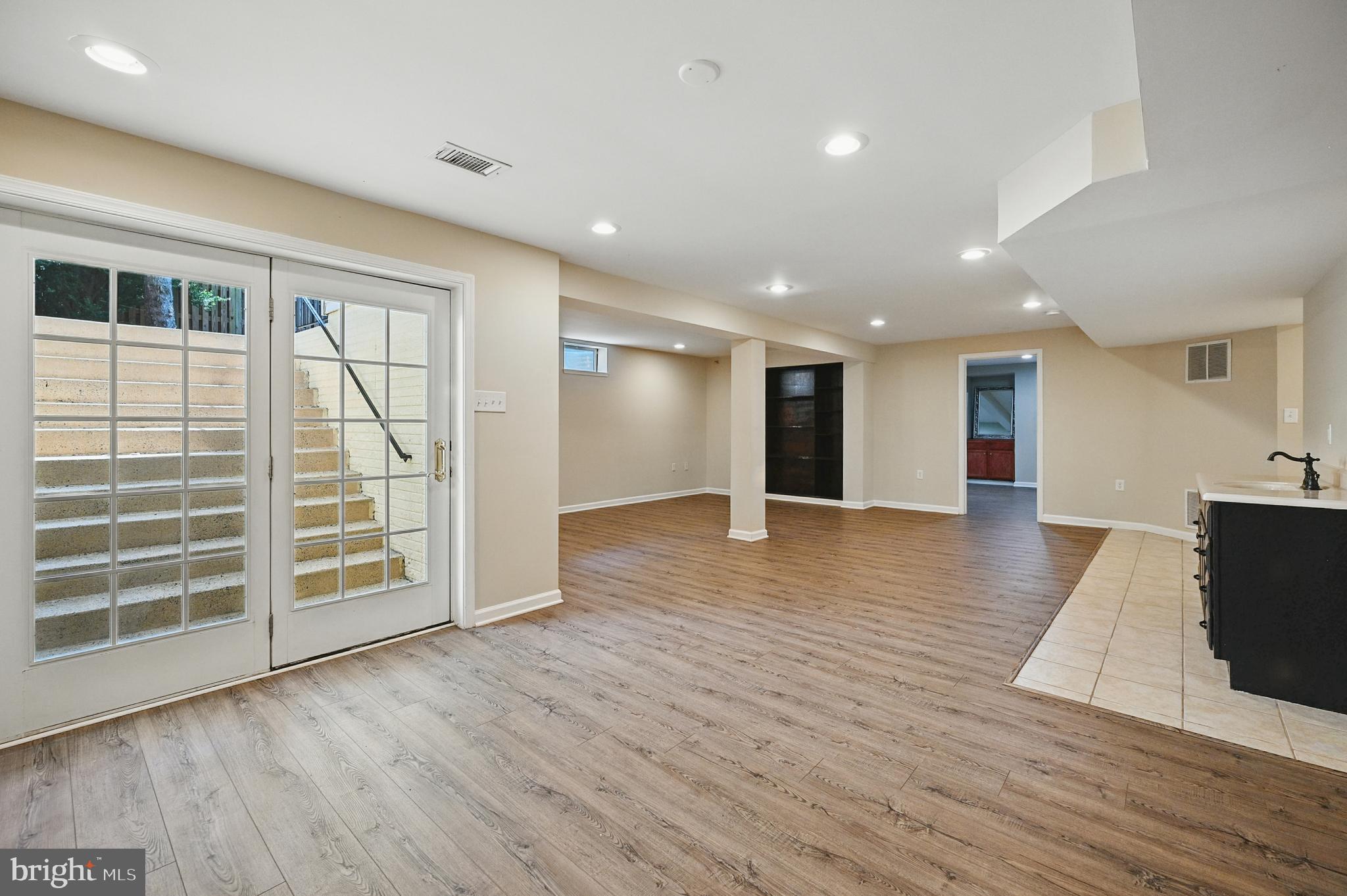 10861 Hunter Gate Way Reston, VA 20194 - Photo 52 of 79 a view of an empty room with wooden floor and a window