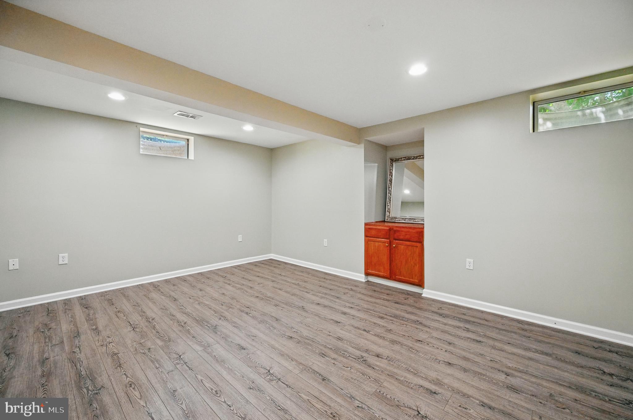 10861 Hunter Gate Way Reston, VA 20194 - Photo 56 of 79 a view of an empty room with wooden floor