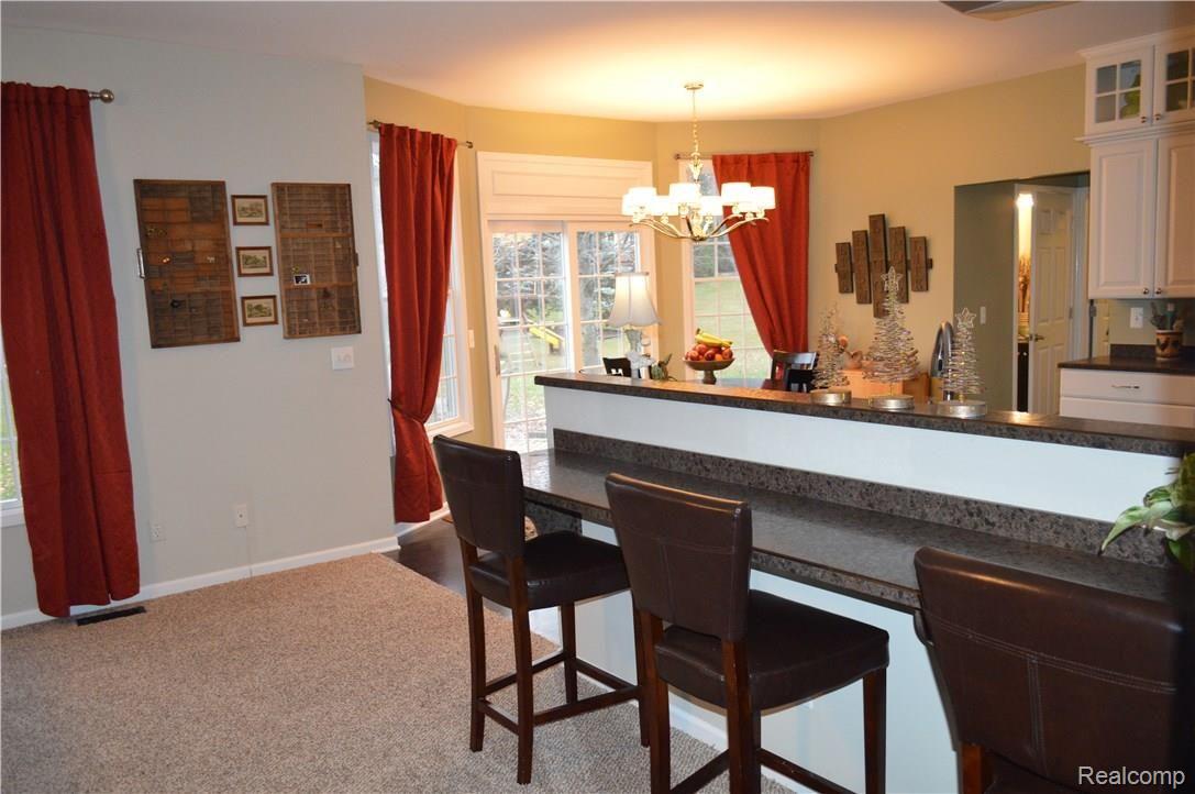 742 Caribou Court Rochester, MI 48307 - Photo 10 of 58 Snack bar between great room and kitchen