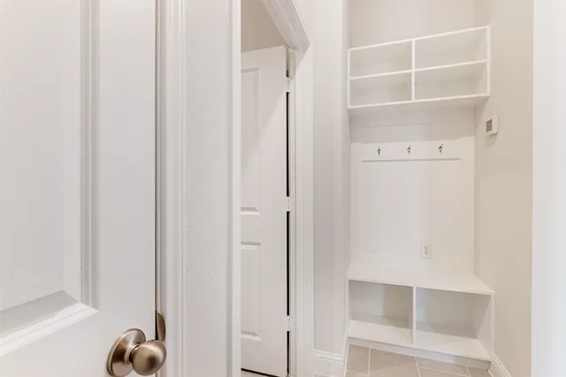 a view of staircase with white walls