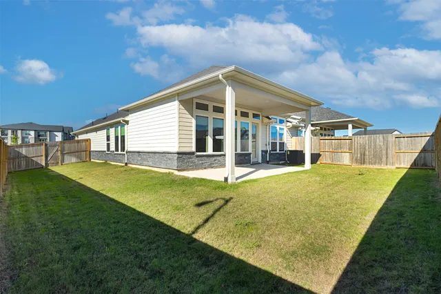 a swimming pool with some trees in the background