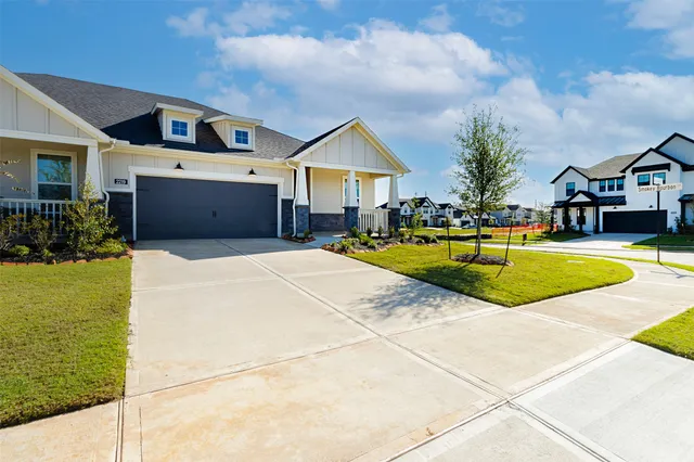 a view of house with swimming pool and chairs in front of house