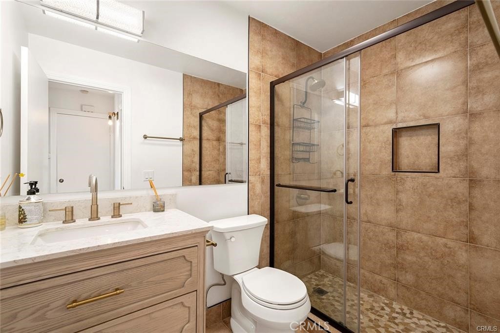 17034 Colima Road, Unit 126 Hacienda Heights, CA 91745 - Photo 14 of 24 a bathroom with a sink a toilet and shower