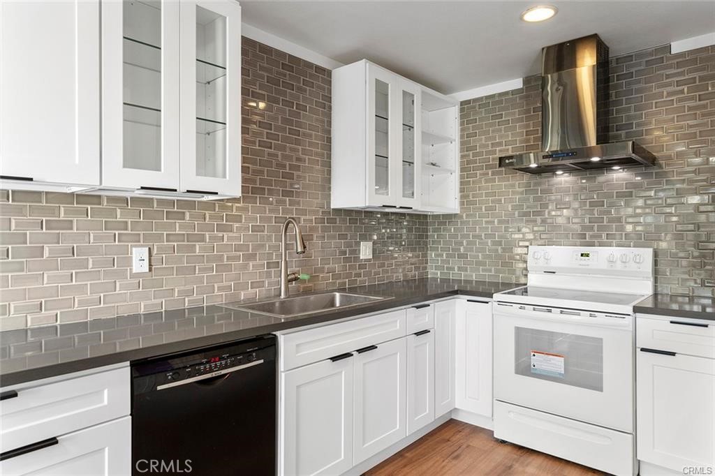 17034 Colima Road, Unit 126 Hacienda Heights, CA 91745 - Photo 8 of 24 a kitchen with stainless steel appliances white cabinets and a sink