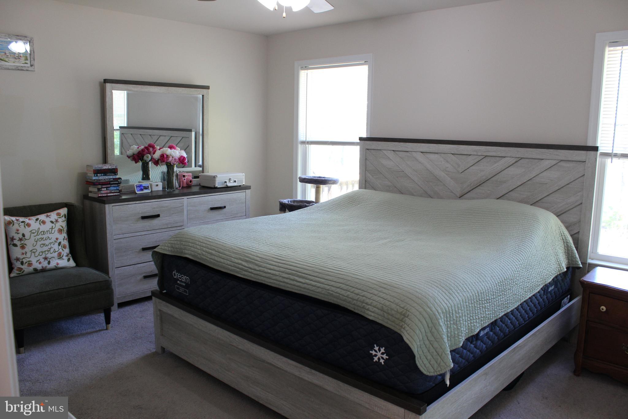 48 Rustic Lane Colonial Beach, VA 22443 - Photo 12 of 29 a bedroom with a bed and window