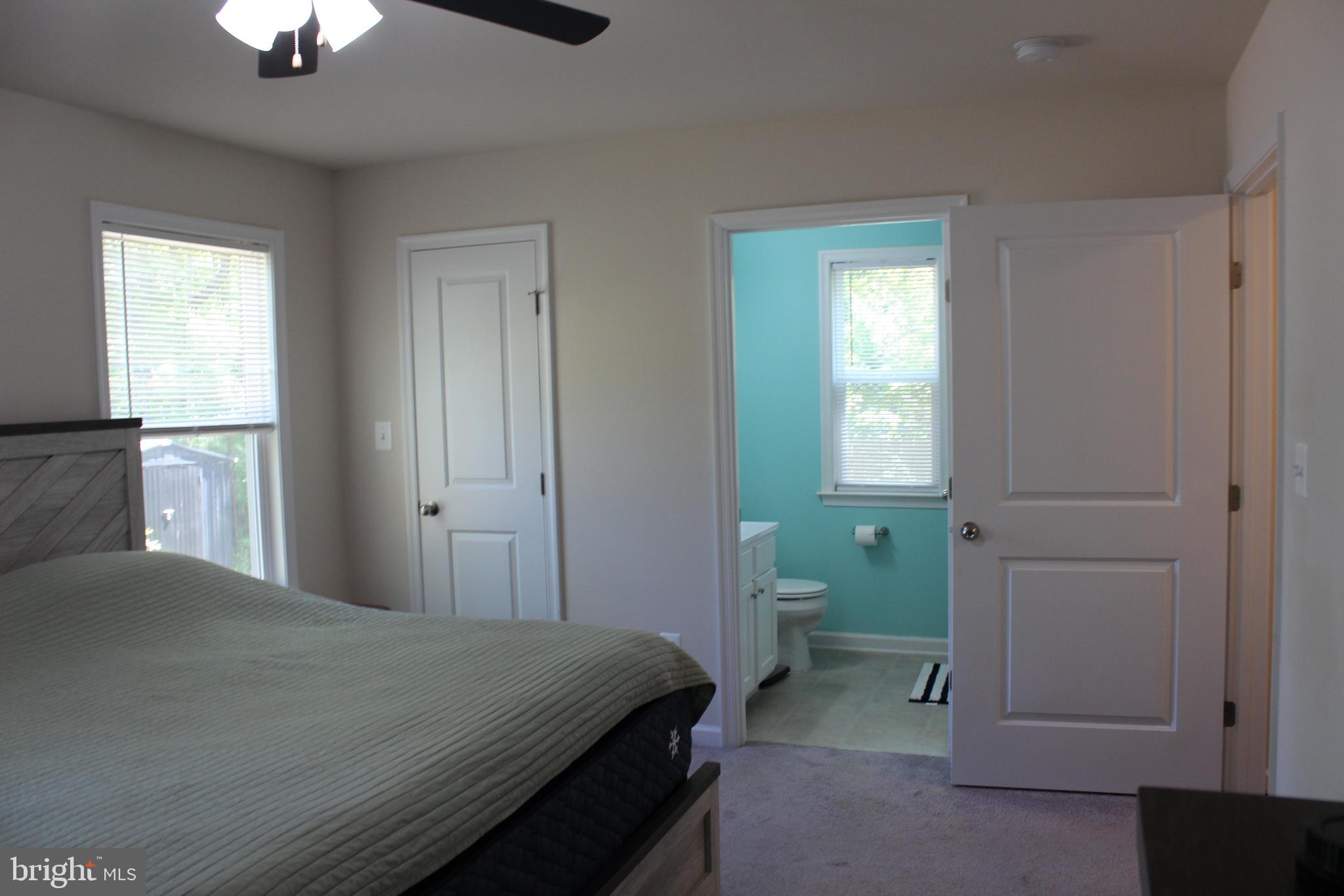 48 Rustic Lane Colonial Beach, VA 22443 - Photo 14 of 29 a bedroom with a bed and a window