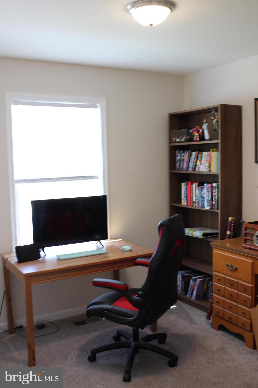 48 Rustic Lane Colonial Beach, VA 22443 - Photo 19 of 29 a view of a workspace with a window and shelf