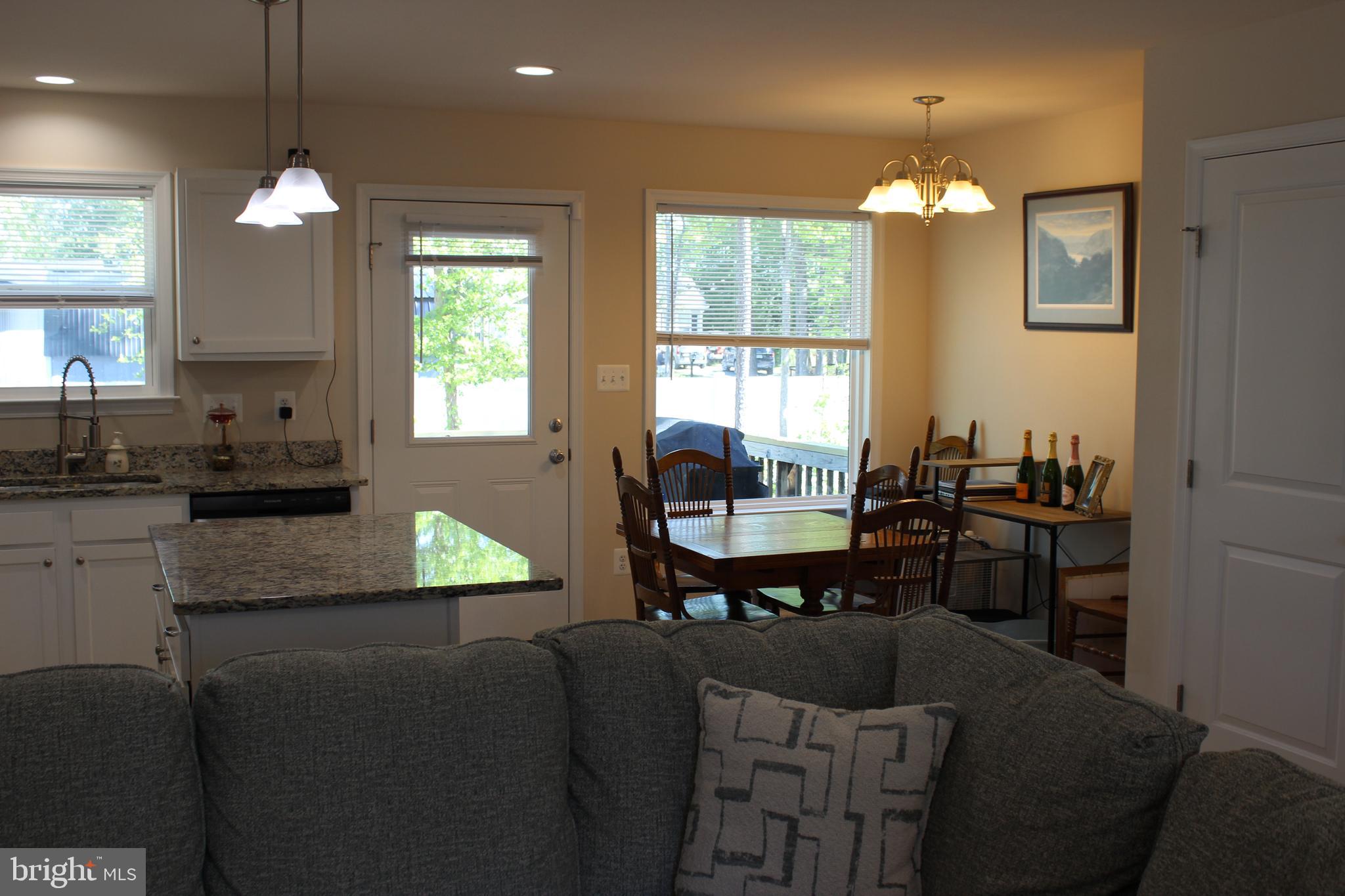 48 Rustic Lane Colonial Beach, VA 22443 - Photo 20 of 29 a kitchen with cabinets table and chairs