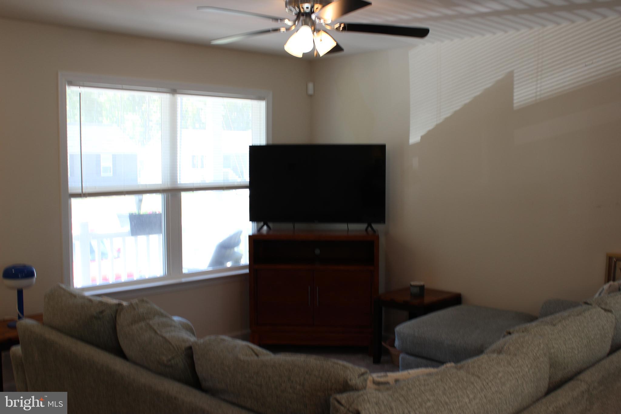 48 Rustic Lane Colonial Beach, VA 22443 - Photo 23 of 29 a living room with furniture and a window