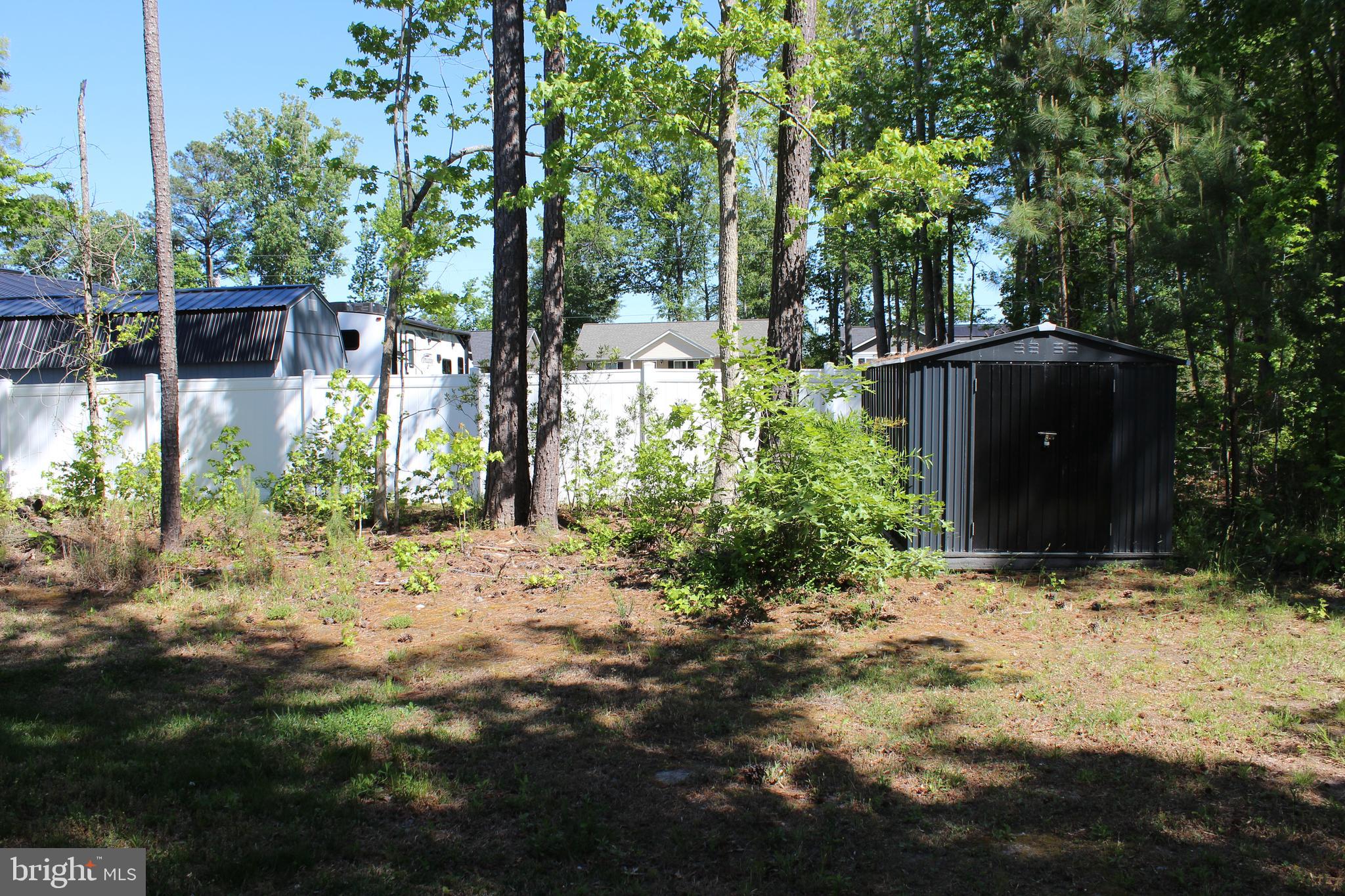 48 Rustic Lane Colonial Beach, VA 22443 - Photo 26 of 29 a backyard of a house with lots of green space