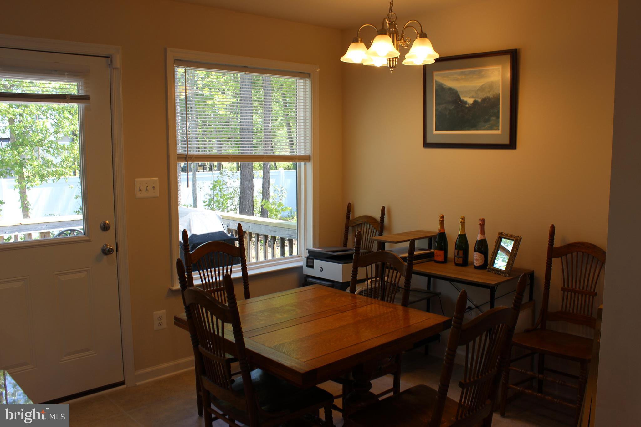 48 Rustic Lane Colonial Beach, VA 22443 - Photo 7 of 29 a view of a dining room with furniture window and outside view