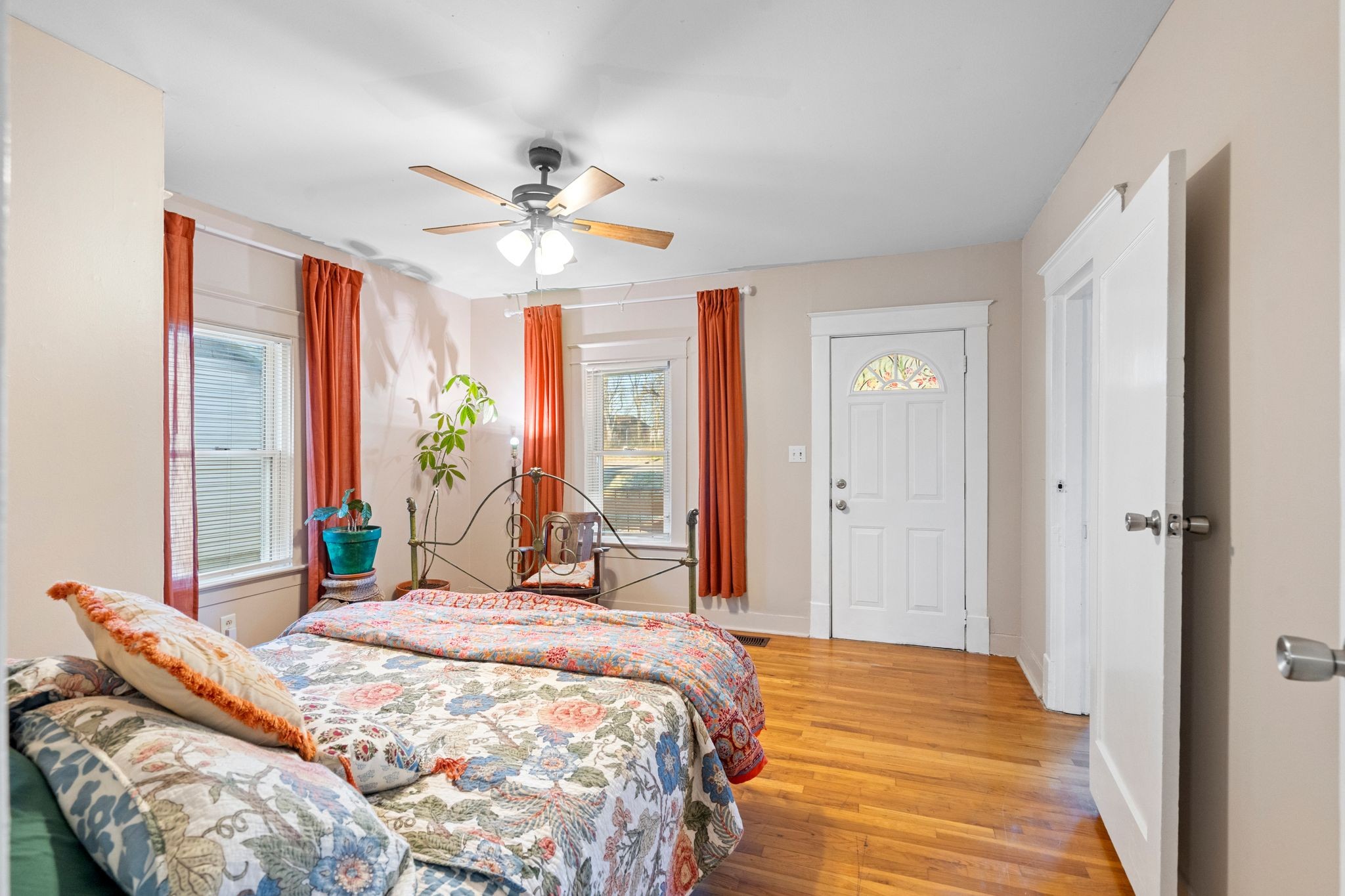 1712 County Hospital Road Nashville, TN 37218 - Photo 17 of 31 a bedroom with a bed and large windows