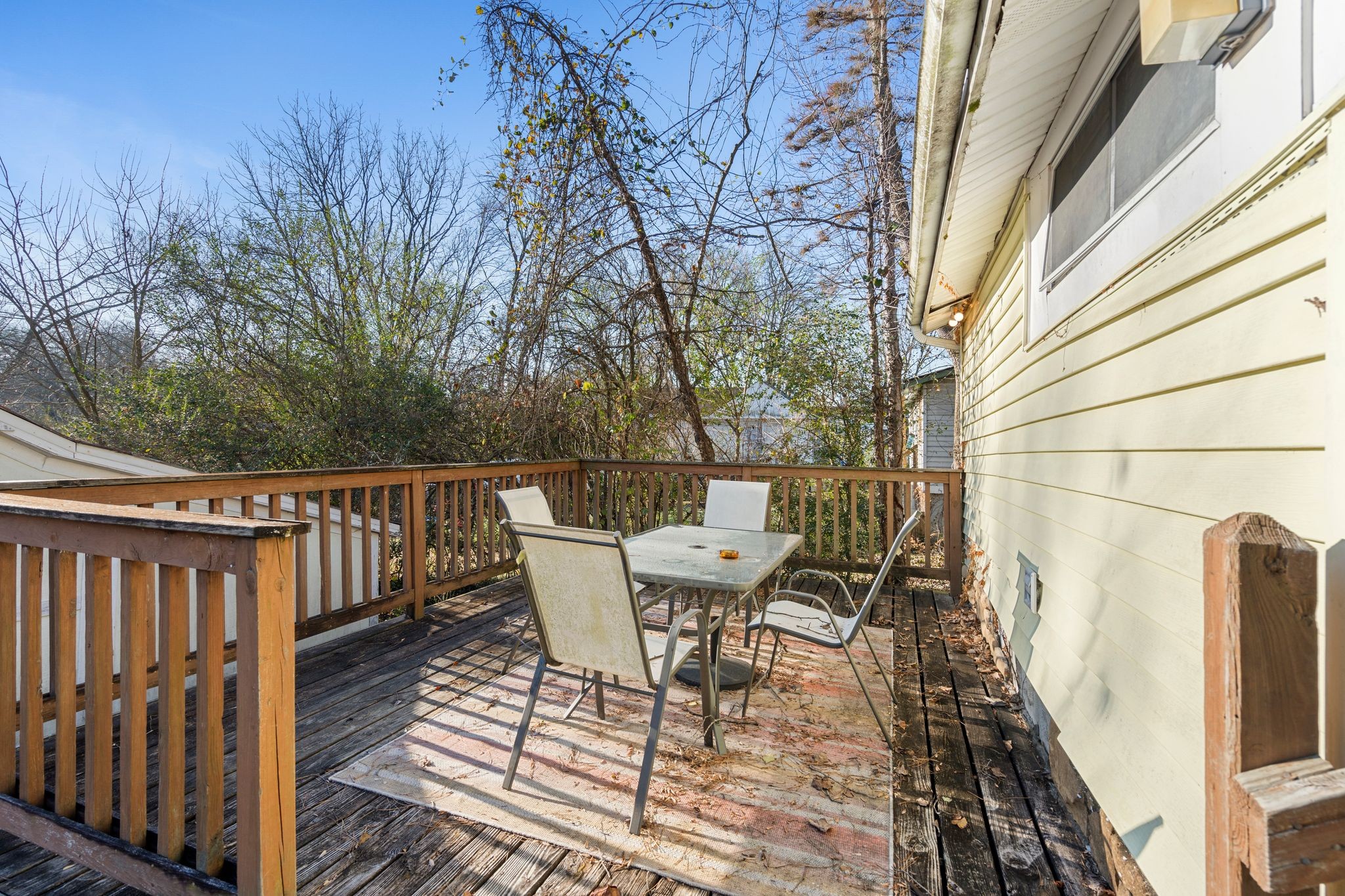 1712 County Hospital Road Nashville, TN 37218 - Photo 25 of 31 a roof deck with table and chairs and wooden floor