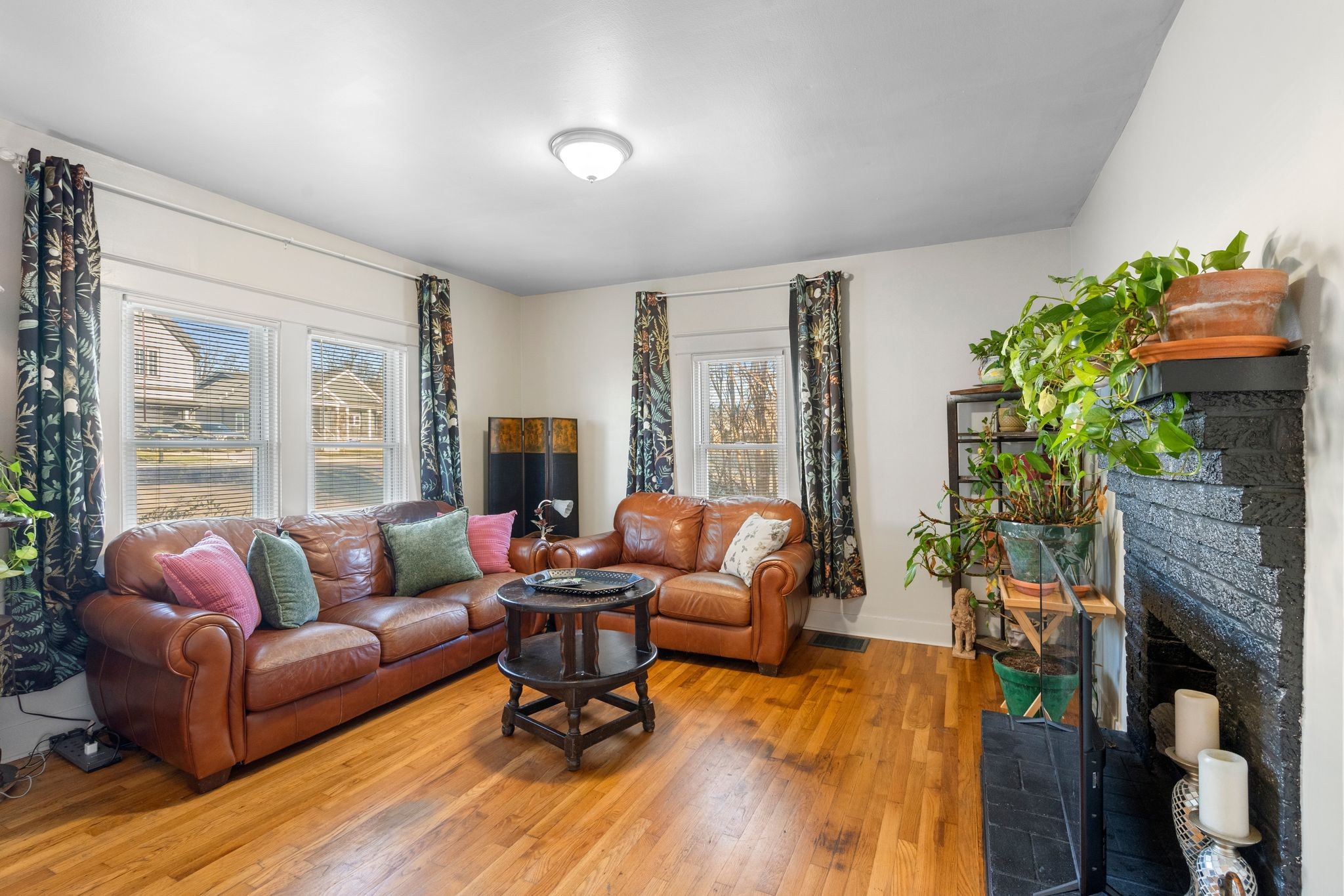 1712 County Hospital Road Nashville, TN 37218 - Photo 5 of 31 a living room with furniture a fireplace and a potted plant