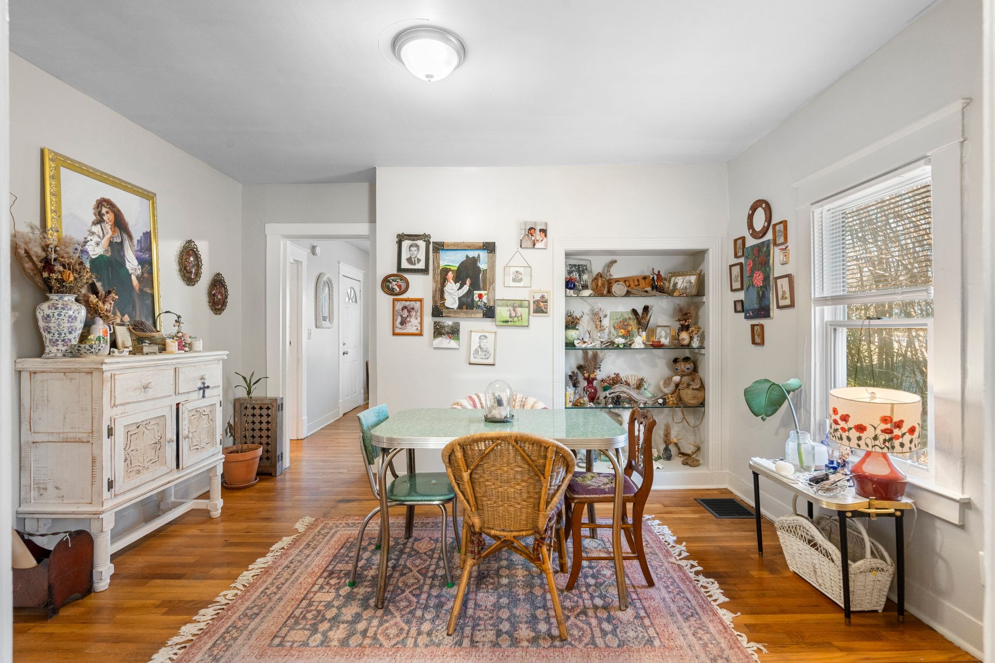1712 County Hospital Road Nashville, TN 37218 - Photo 9 of 31 a living room with furniture and paintings on the wall next to a window