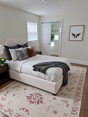 a bedroom with a bed and a painting on the wall